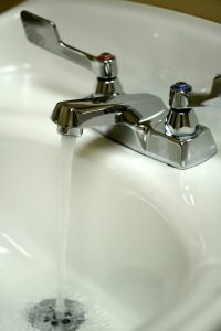 bathroom-sink-faucet-turned-on