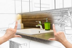 hands-poised-to-envision-future-bathroom-setting