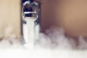 hot-water-coming-from-faucet-with-steam