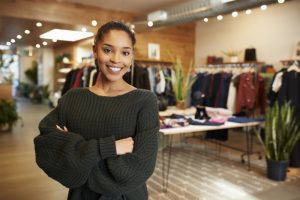 woman-business-owner-standing-in-clothing-shop